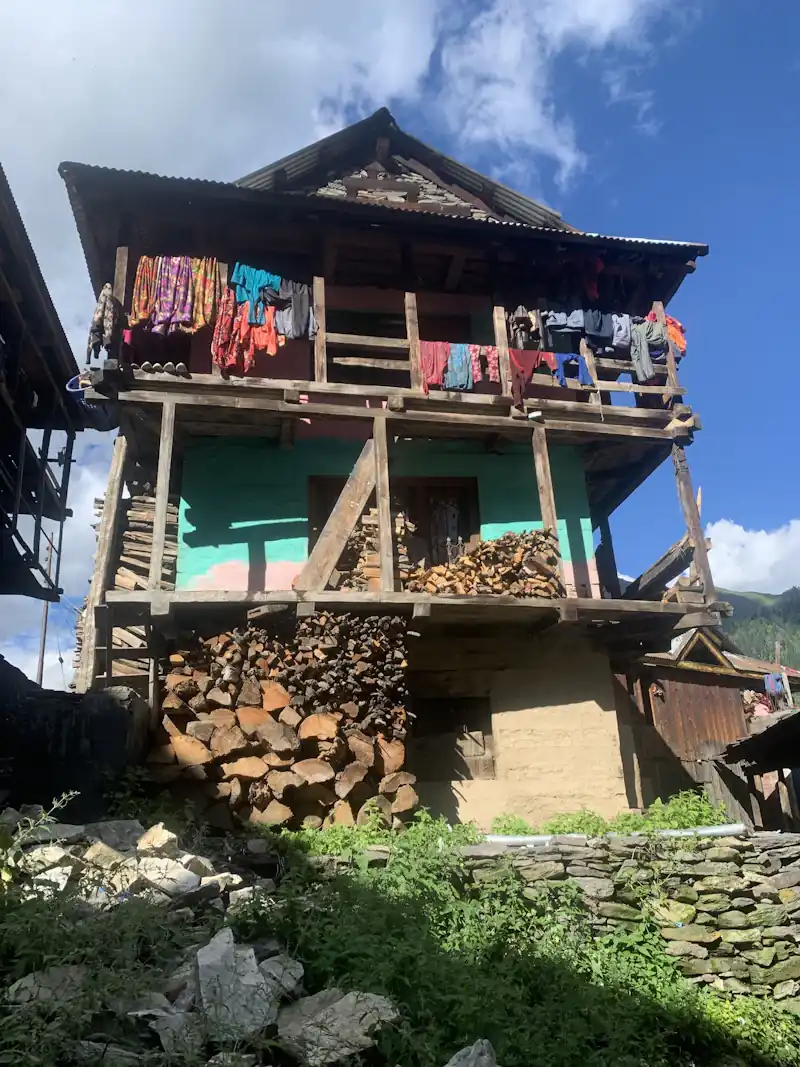 Wooden houses on a mountain slope in the Himalaya.